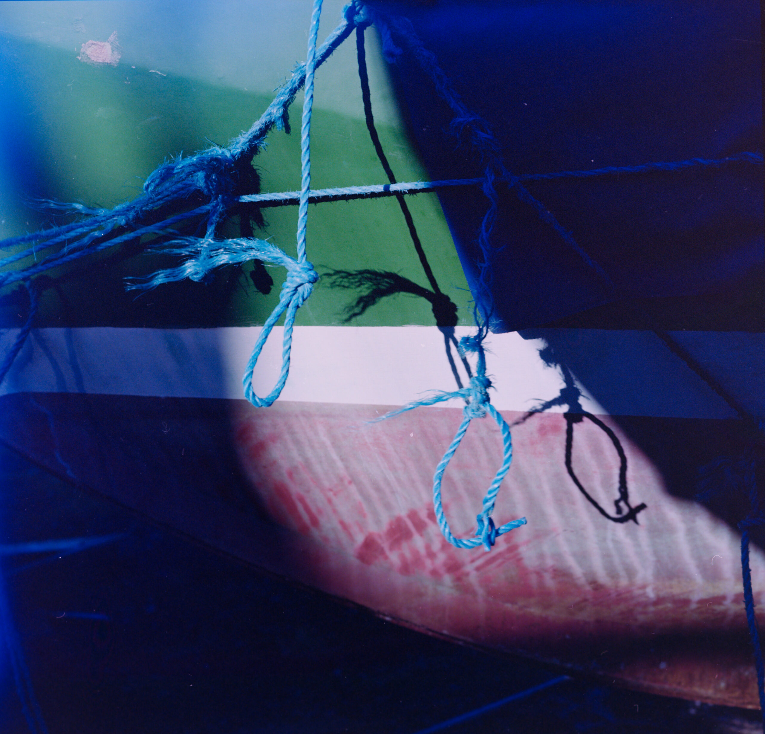 Abstract close-up of frayed blue ropes and knots