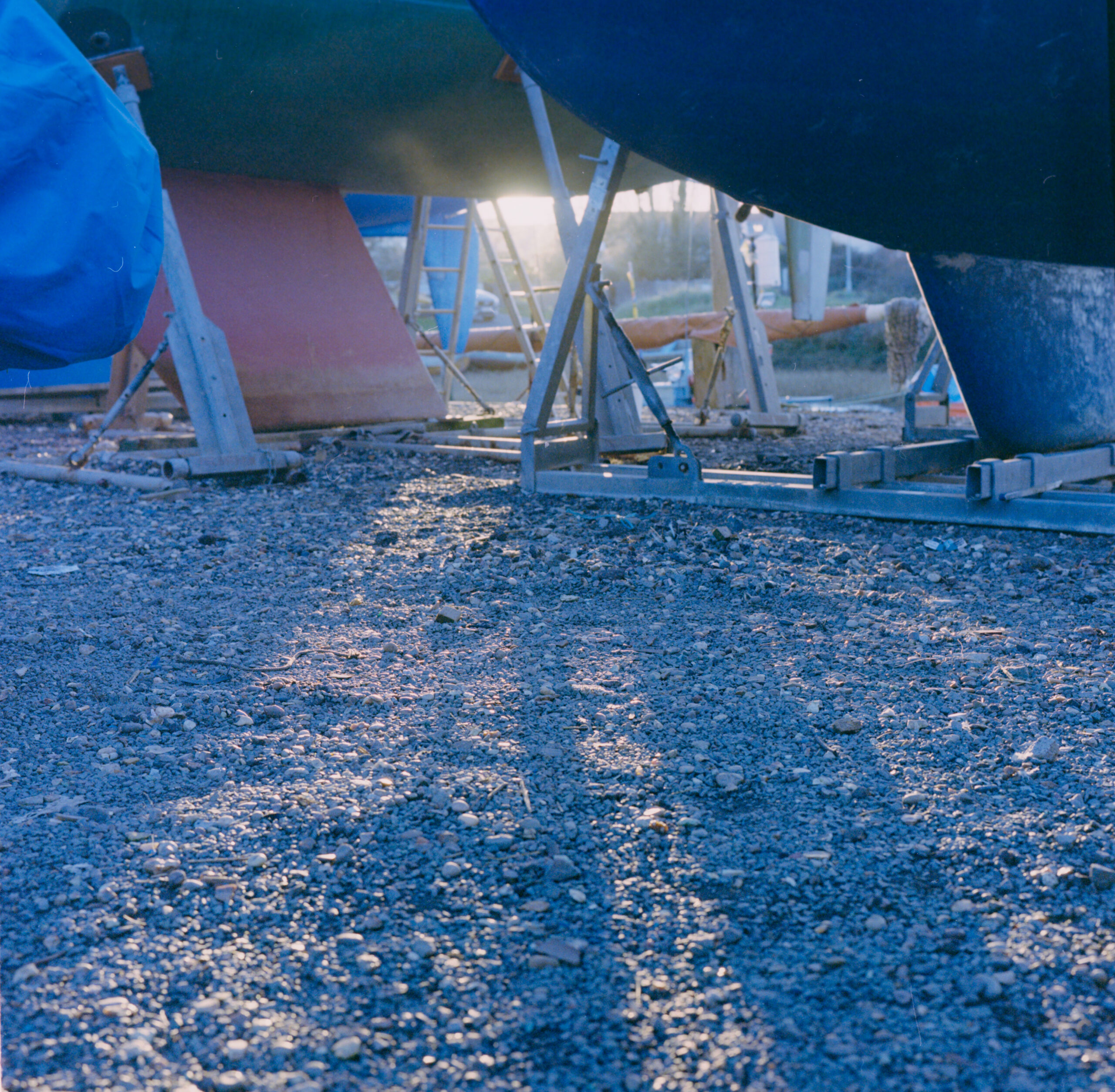 Underside of a boat on supports in a boatyard