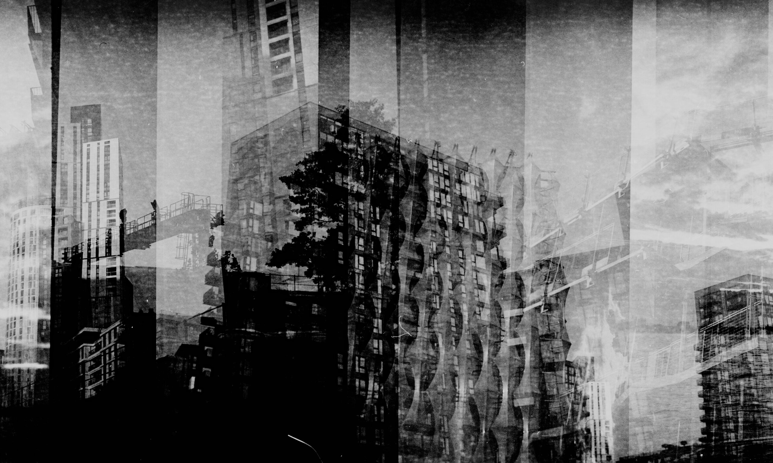 High-contrast monochrome composite of skyscrapers beams and trees