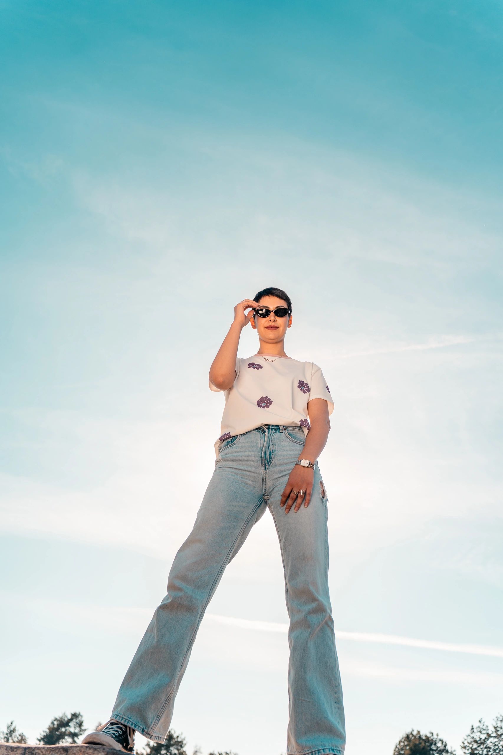 Minimal portrait against a bright sky